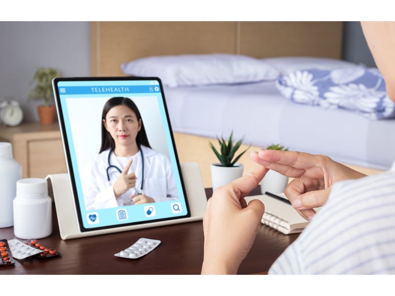 Doctor and patient use sign language over video chat
