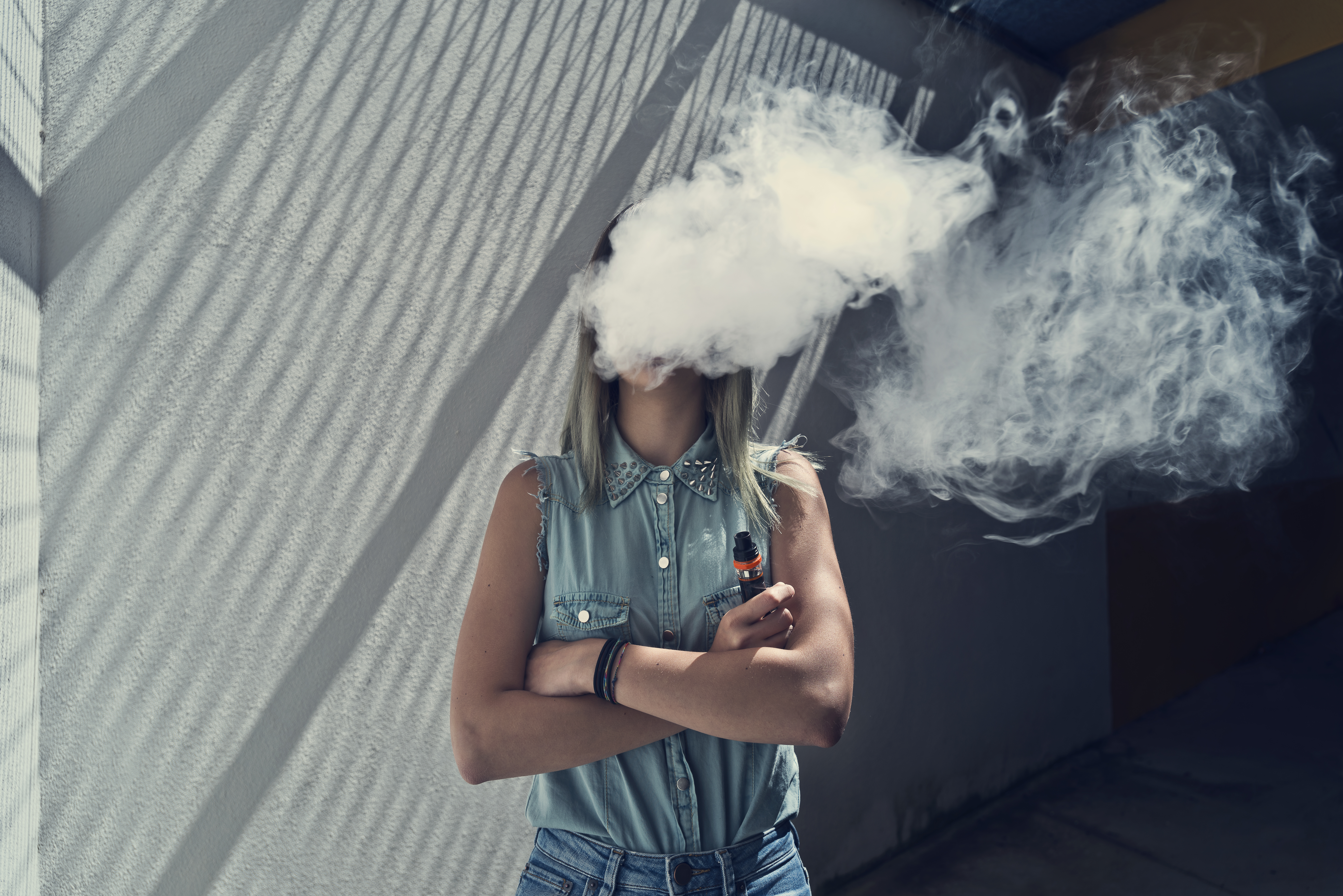 Massachusetts AG Files Vaping Lawsuit Woman Vaping