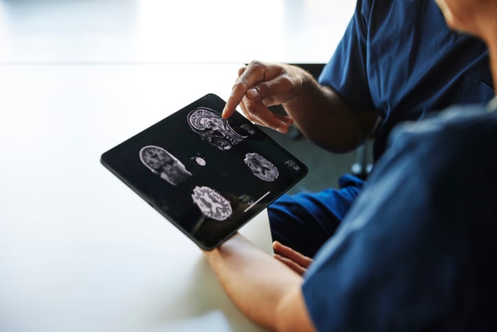 Two doctor's review an x-ray together.